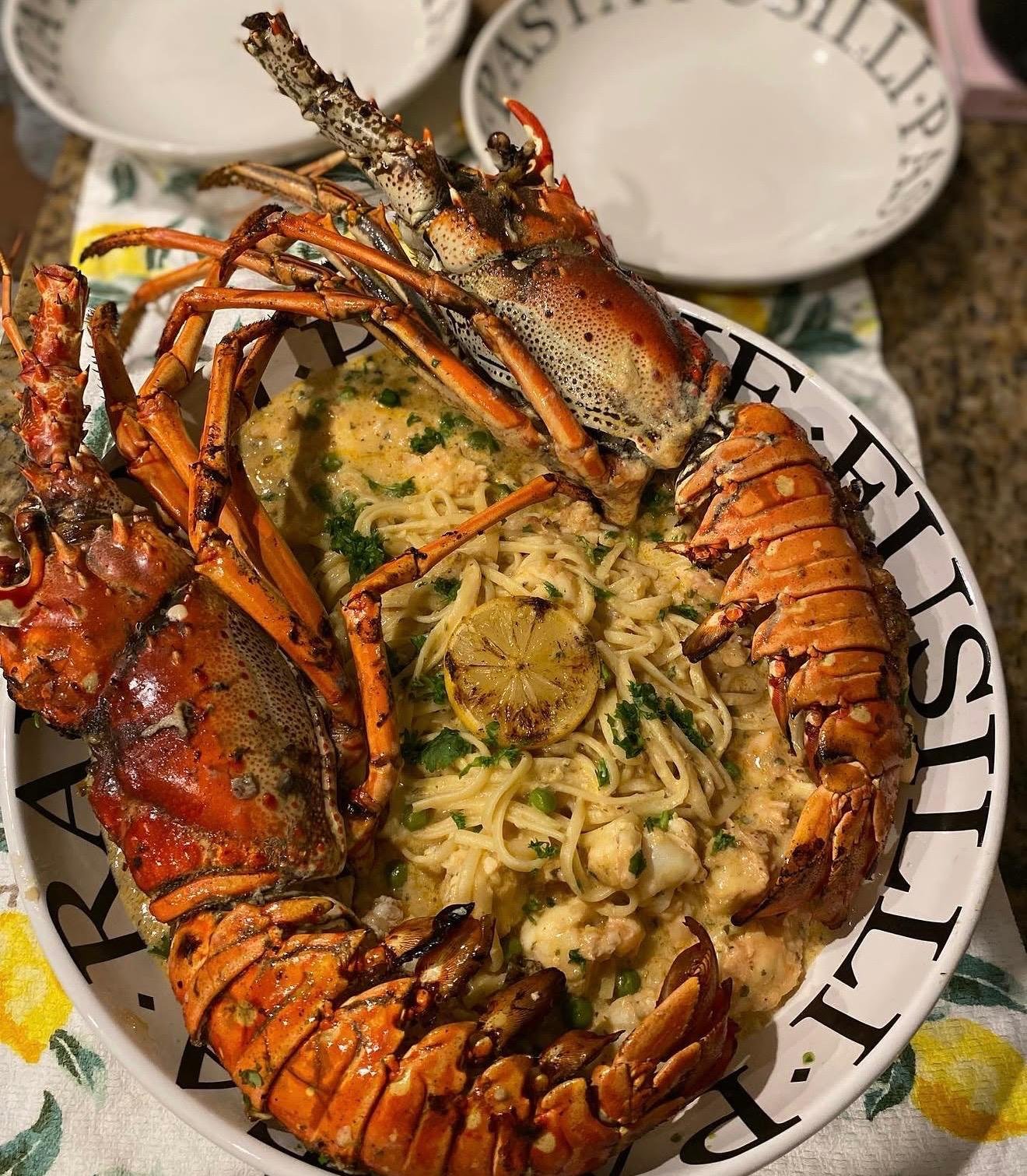Whole grilled Bahamian lobster over lemon-herb pasta